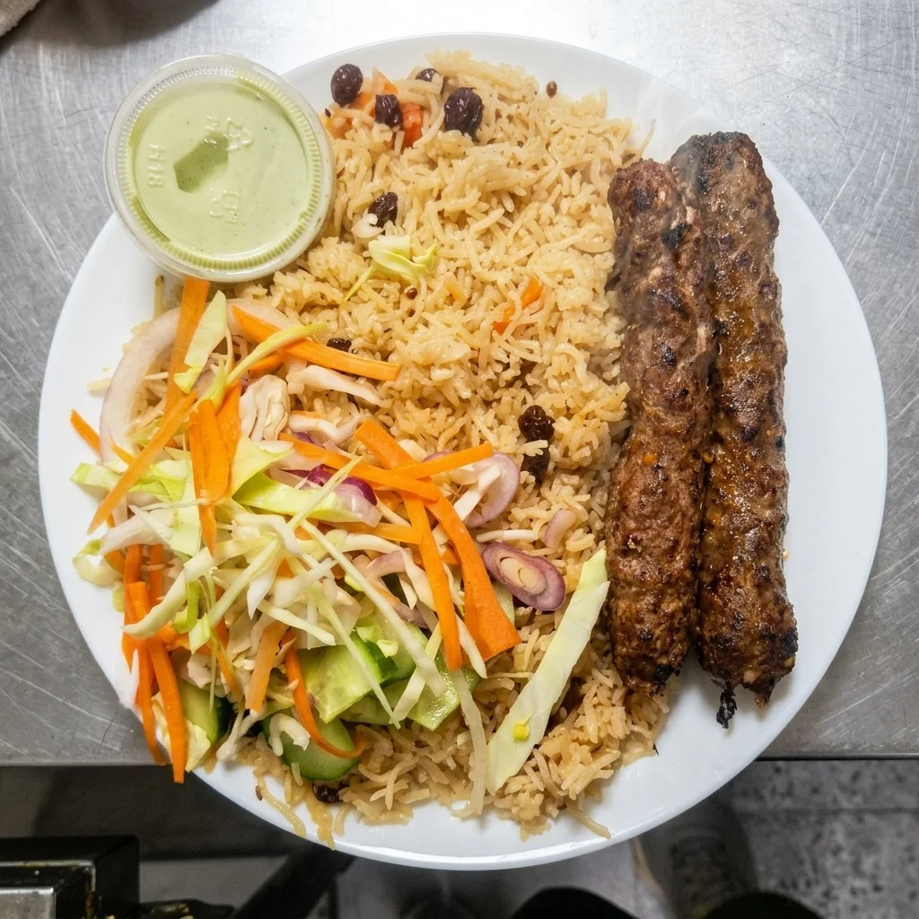 Kabuli Rice with Beef Seekh Kebab and fresh salad at Chenab Halal Pakistani Restaurant Edmonton